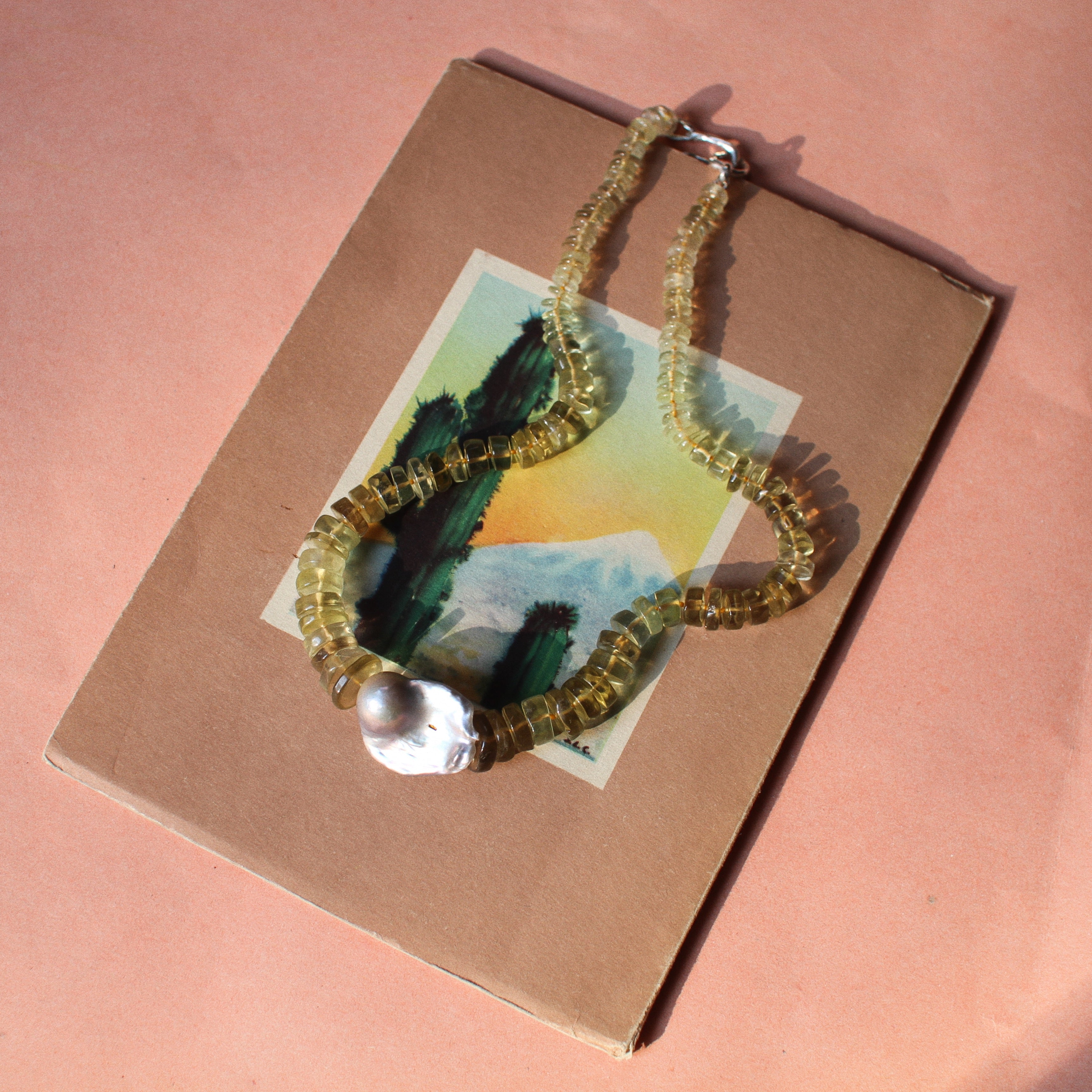 Lemon Quartz bead and Baroque Pearl.
